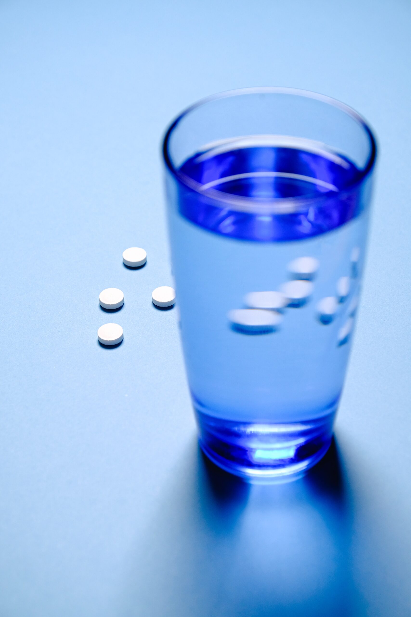 A glass with some pills